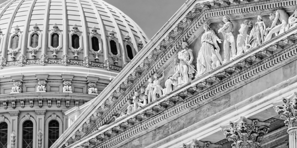 A black and white photo of the US capitol building