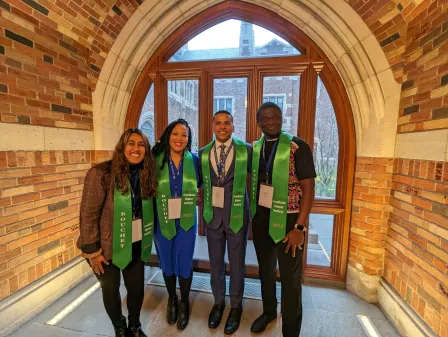 2023 Inductees stand together wearing green honors sashes